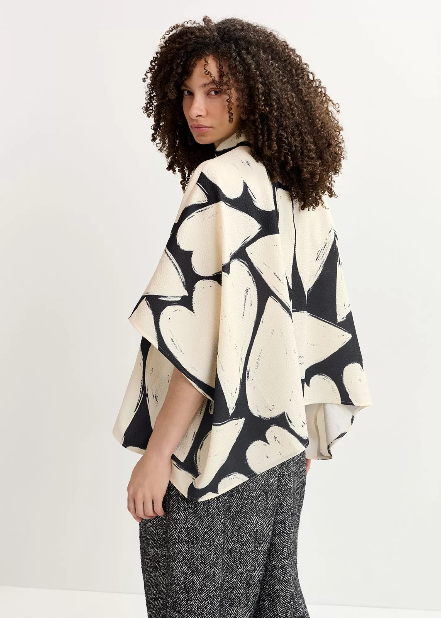 Hot Black and off-white oversized top with stand-up collar Fall 2024 Collection | Prints