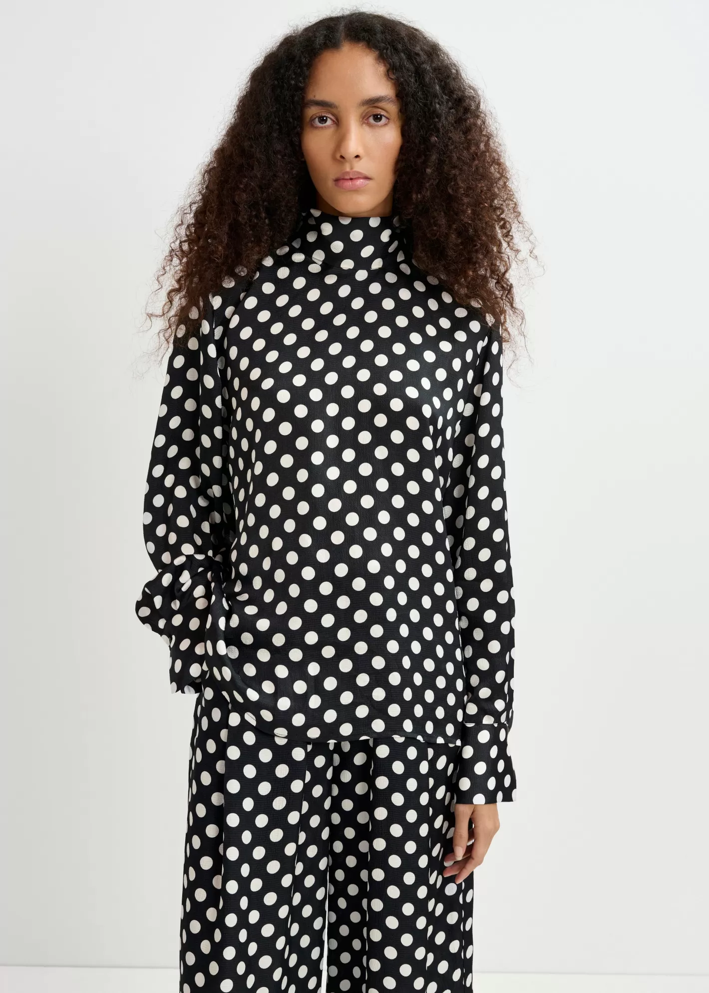 Store Black and white polka-dot top with pussy bow Partywear | Tops & Blouses